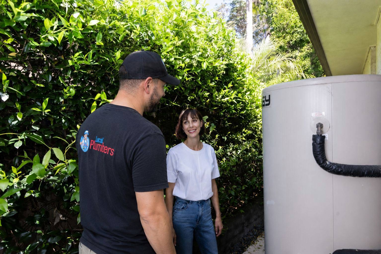 Local plumber with customer